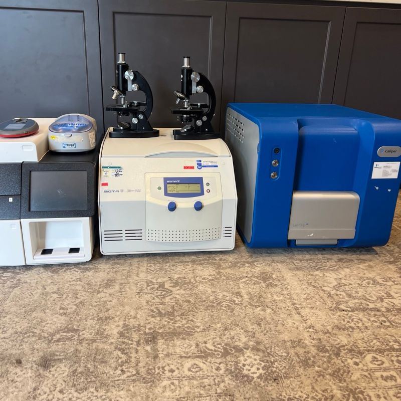 A recovered centrifuge, two microscopes and a Caliper LabChip DNA sequencer